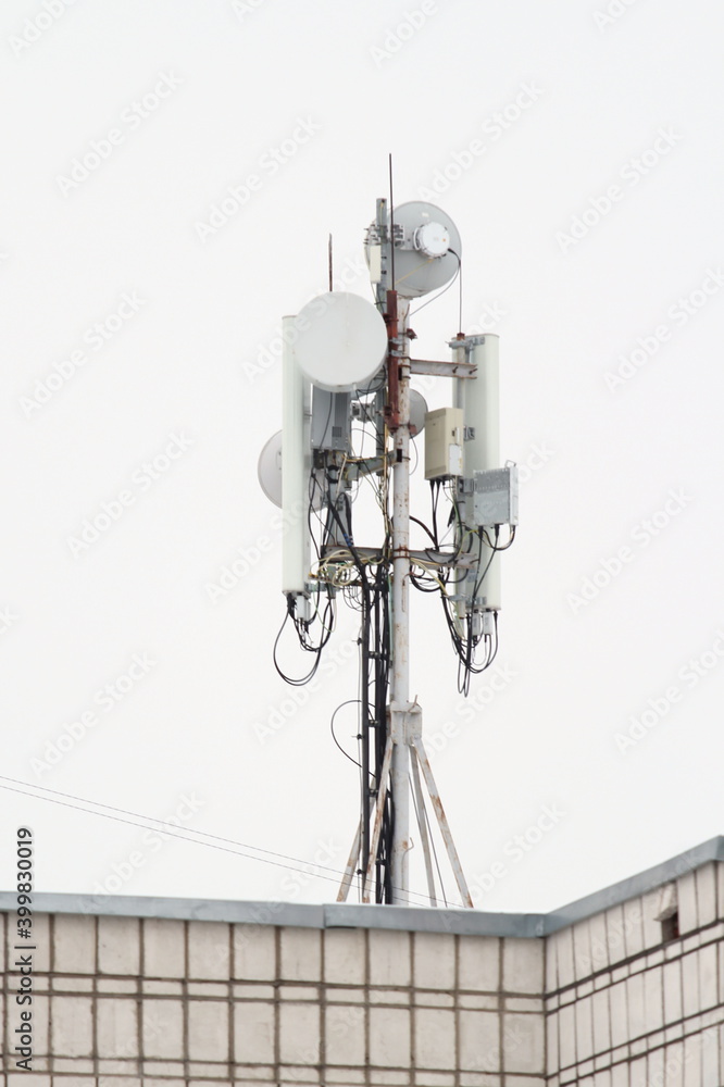 Base station mobile network antenna on a steel structure mast with a repeater. Base station mobile network antenna on a steel structure mast with a repeater.