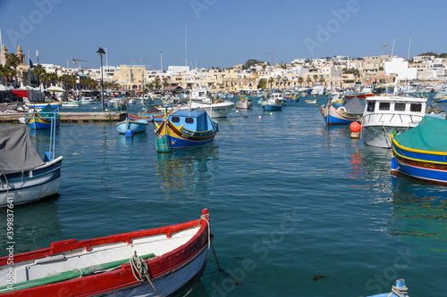 Traditional eyed colorful boats Luzzu in the Harbor of Mediterranean fishing village Marsaxlokk  Malta