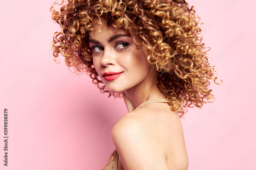 Attractive woman Bare back and curly hair charm pink background Attractive woman Bare back and curly hair charm pink background