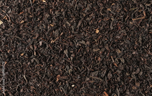 Black tea leaves background and texture