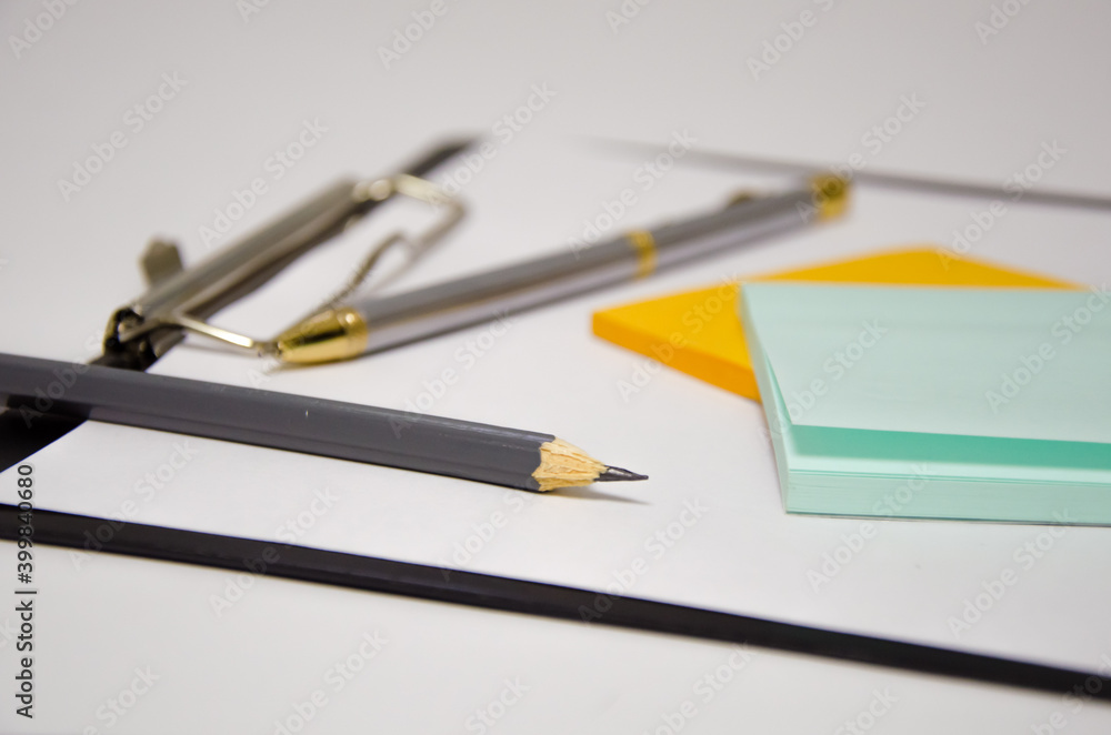 pen stickers office tablet lies on white background pen stickers office tablet lies on white background
