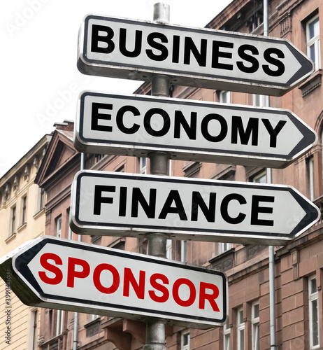 The road indicator on the arrows of which is written - business  economics  finance and SPONSOR