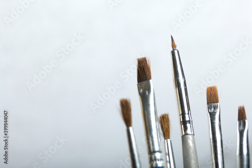 Paint brushes. On a light background.