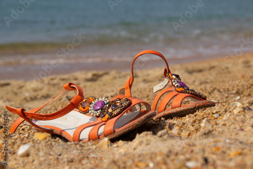 Sandals stand on the sea sand