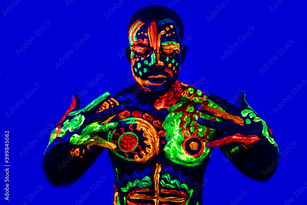afro american man posing in studio shot with UV light afro american man posing in studio shot with UV light