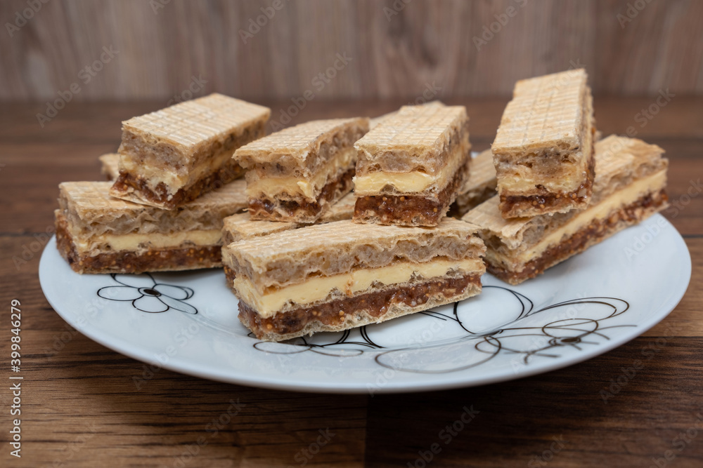 Tasty chocolate, figs, and vanilla wafers sandwich. Creamy wafer biscuit texture.