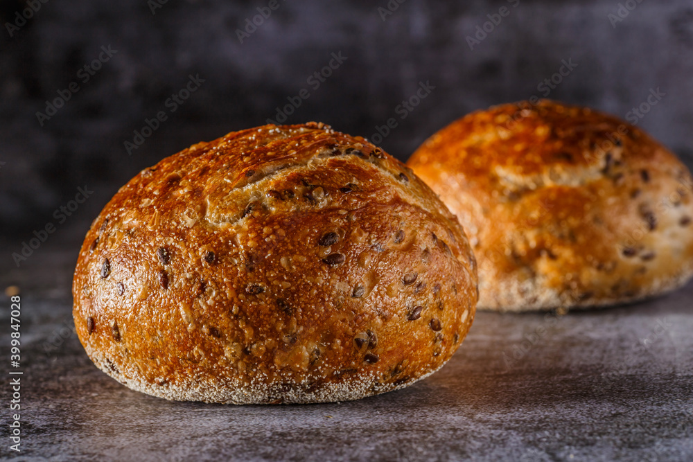 Assortment of baked bread on wooden table background Fresh fragrant bread on the table. Food concept.