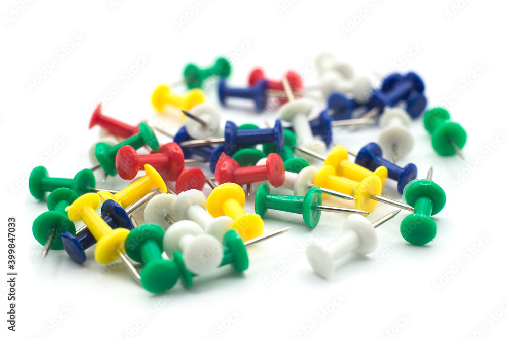 Closeup of colorful paper pins on white background Closeup of colorful paper pins on white background
