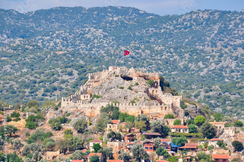 Kalekoy fortress over ancient city of Simena in south Turkey photo