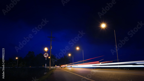 Long-exposure of traffic light trails at nigh. © chokchaipoo