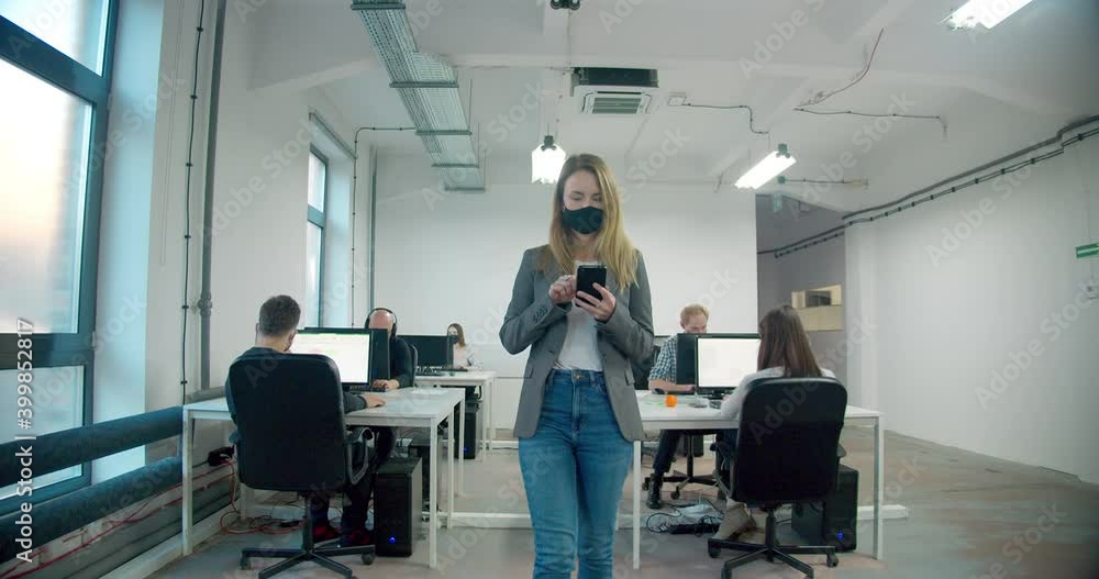 MS DS Manager watching over office workers wearing face masks during pandemic MS DS Manager watching over office workers wearing face masks during pandemic