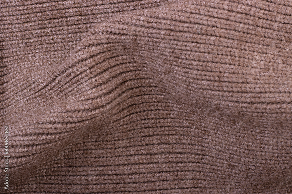 Dark brown knitted wool texture background