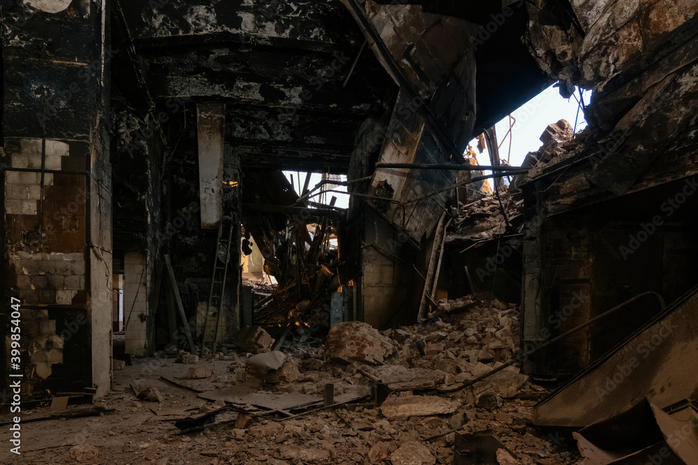 Burnt and ruined interior of industrial building after fire. Consequences of war, fire or other disaster Burnt and ruined interior of industrial building after fire. Consequences of war, fire or other disaster