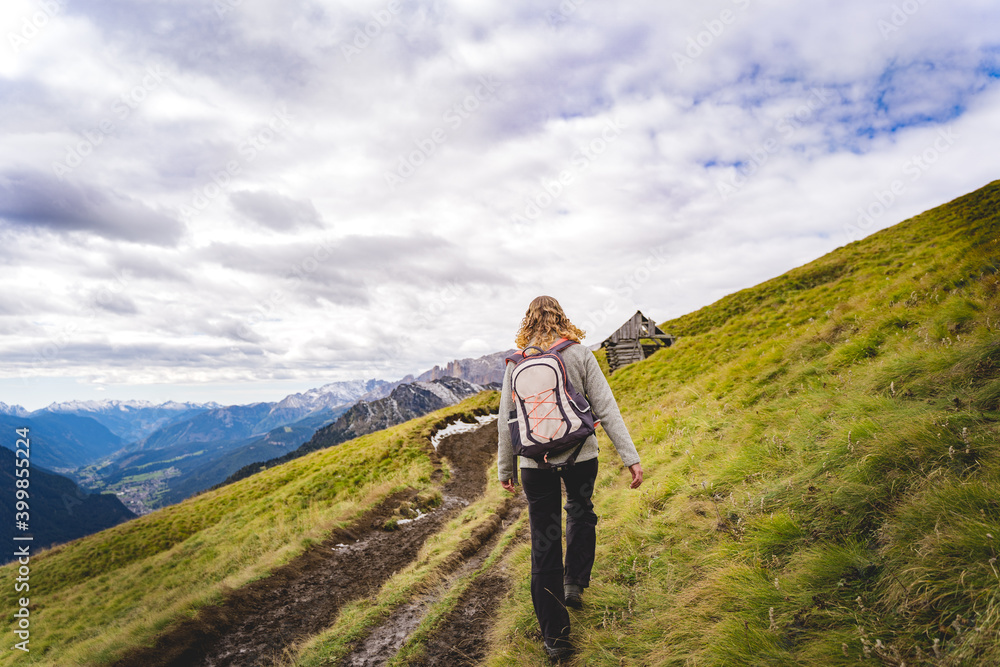female hiker hiking in the alps