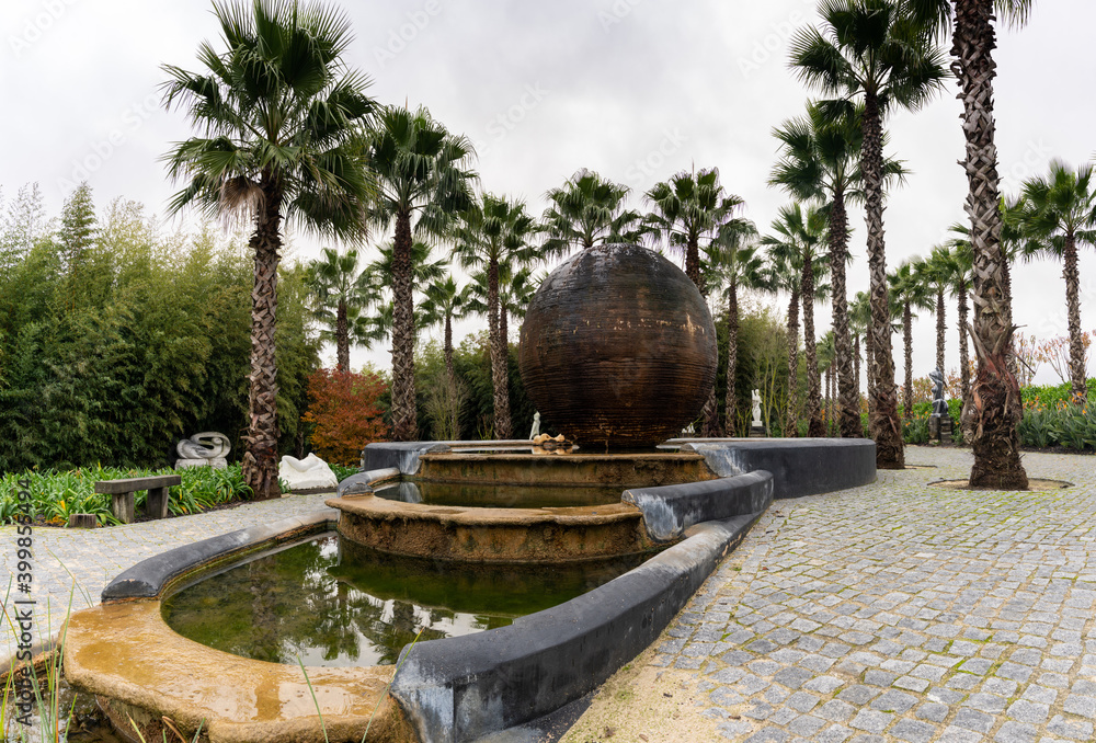 sculpture fountain and palm gardens in the Buddha Eden Garden in Portugal sculpture fountain and palm gardens in the Buddha Eden Garden in Portugal