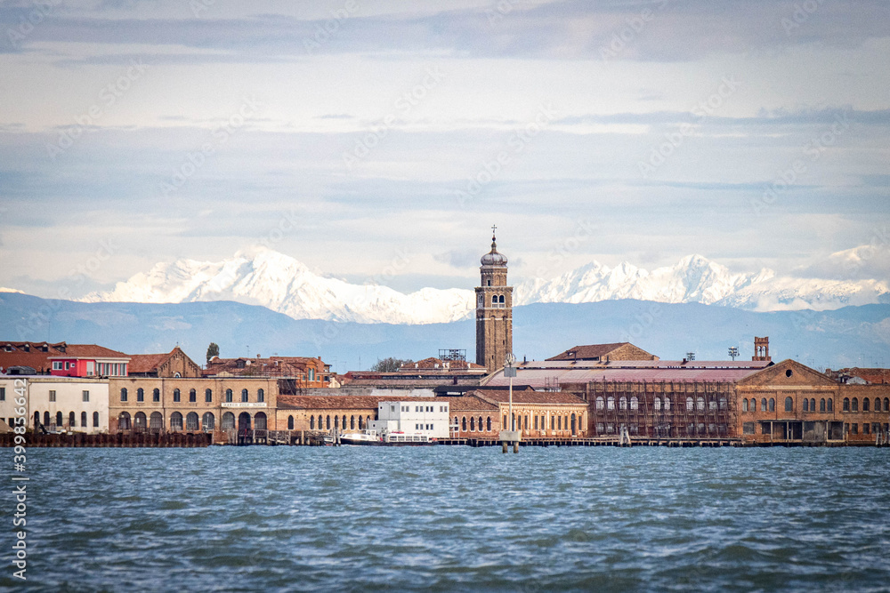 Murano Island with snow capped Alpes in background