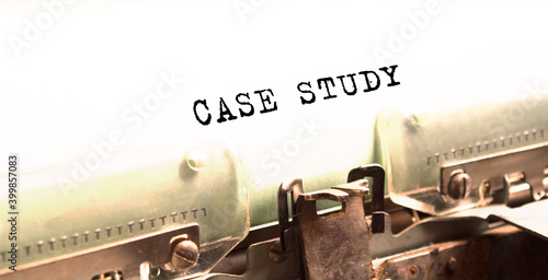 The text CASE STUDY is typed on paper by an antique typewriter. Vintage inscription, retro style, grunge, concept.