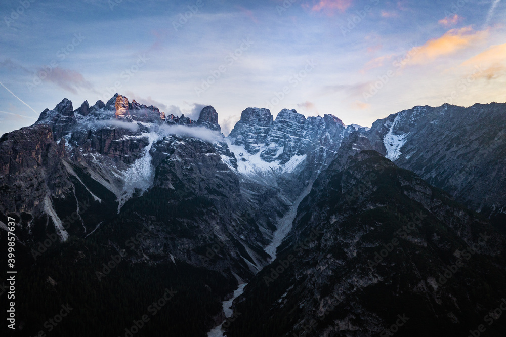 dawn in the snow covered mountains of the alps dawn in the snow covered mountains of the alps