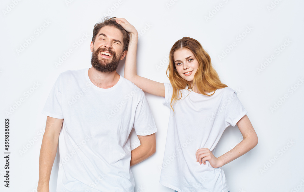 Enamored woman and man t-shirts family friends having fun gesturing with their hands Enamored woman and man t-shirts family friends having fun gesturing with their hands