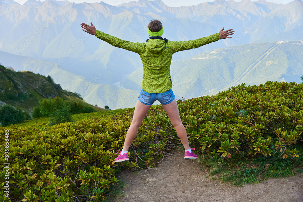 Fototapeta premium person jumping in the mountains
