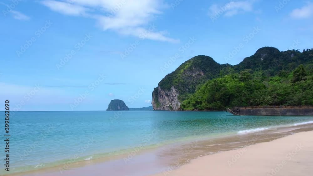 Timelapse of sandy beach in smallisland, blue sky and white clouds moving over blue ocean water. Beautiful nature for holiday vacation in warm tropical country in paradise southern of Thailand Timelapse of sandy beach in smallisland, blue sky and white clouds moving over blue ocean water. Beautiful nature for holiday vacation in warm tropical country in paradise southern of Thailand