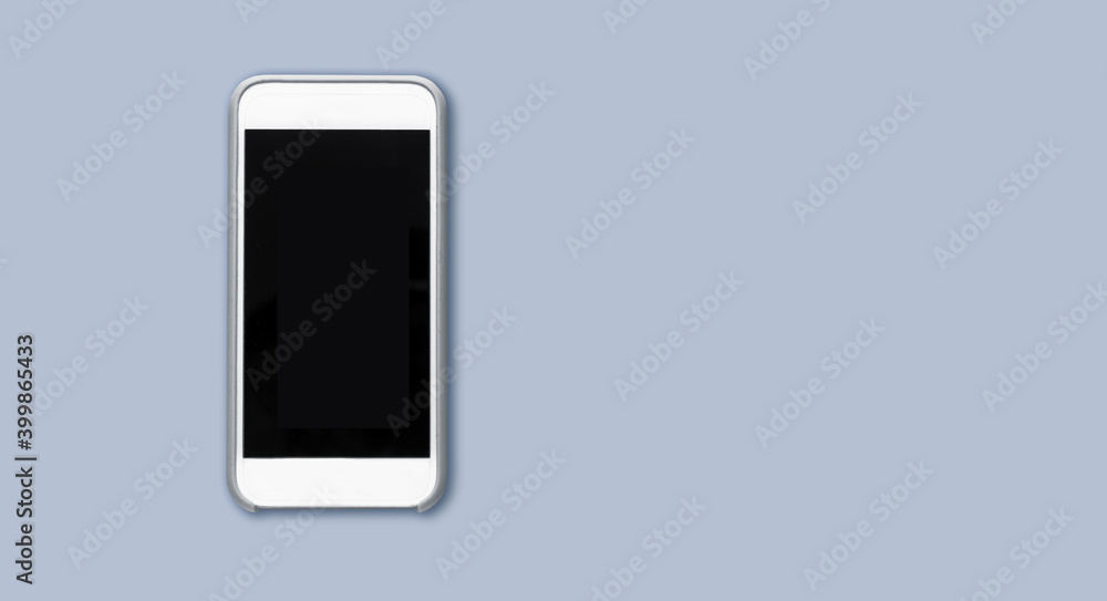 Top view of cell phone with black screen isolated on gray background with ample copytext space Top view of cell phone with black screen isolated on gray background with ample copytext space