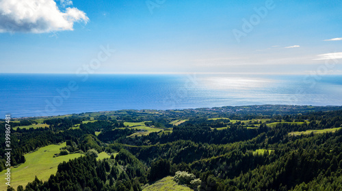 Landscape view over the luxurious green landscape with the Atlantic Ocean in the background. São Miguel Island. Azores. © Vitor Miranda