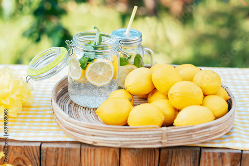 Plate with ripe fresh lemons and lemonade. Vitamins concept