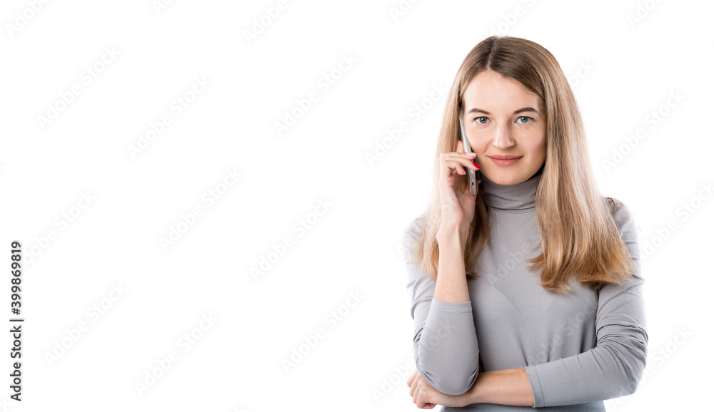 The theme of a business woman and telephone conversations. Beautiful young caucasian woman uses a smartphone handset to call in formal clothes on a white isolate background The theme of a business woman and telephone conversations. Beautiful young caucasian woman uses a smartphone handset to call in formal clothes on a white isolate background
