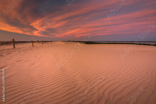 Moving dunes in the S  owi  ski National Park after sunset with an incredibly beautiful sky.