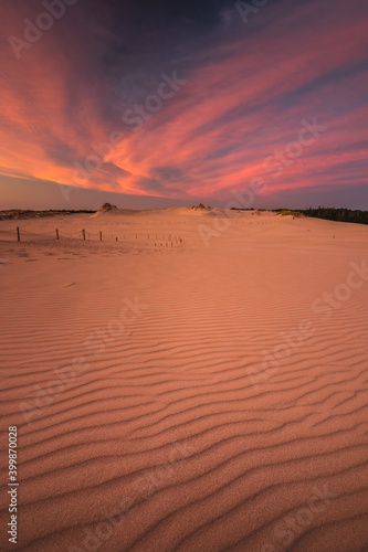 Moving dunes in the Słowiński National Park after sunset with an incredibly beautiful sky.