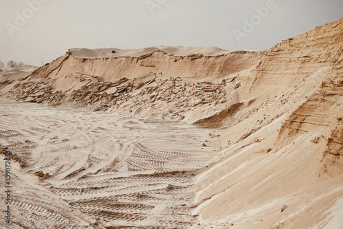 View of the  sand quarry in cold winter in cloudy weather. photo