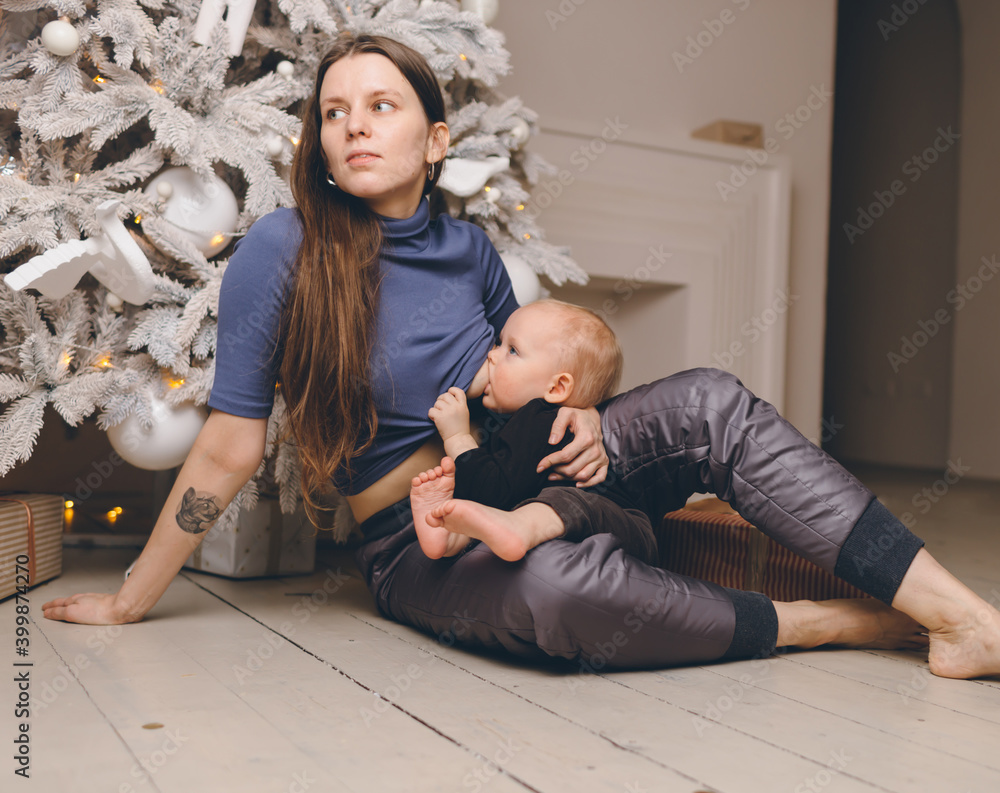 Fototapeta premium Christmas Family and Xmas Tree, Mother give Child New Year Present Gift