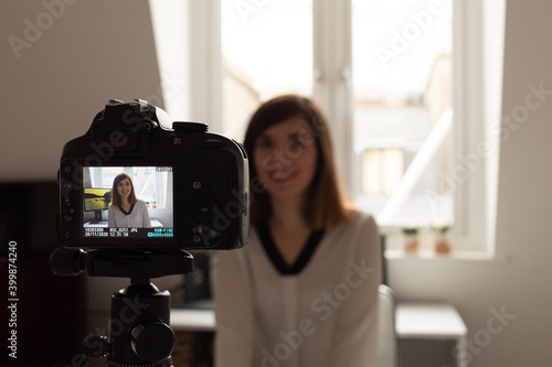Attractive young female recording a video that will be posted on social media with her followers. A lot of new digital content creators have appeared during 2020 due to the coronavirus