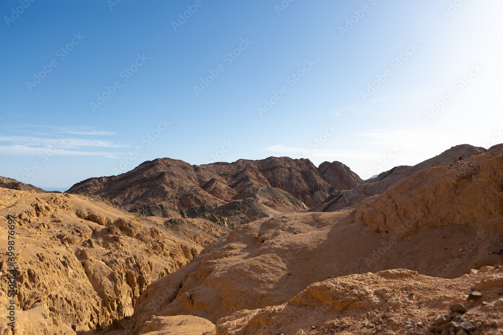 Fototapeta premium Coloured Canyon in Dahab on South Sinai (Egypt) peninsula. Desert rocks of multicolored sandstone background..