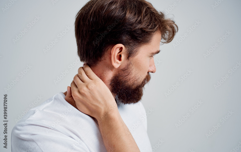 neck pain spine man in t-shirt side view neck pain spine man in t-shirt side view