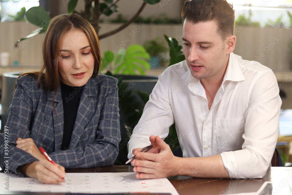 Happy colleague talking while sitting at lobby of modern office or coffee shop, attractive business partner working together, having conversation and discussion about work project Happy colleague talking while sitting at lobby of modern office or coffee shop, attractive business partner working together, having conversation and discussion about work project