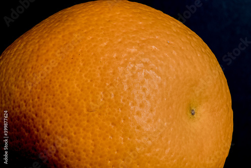 Obraz na płótnie Close up, macro shot of the skin of a orange fruit with pores, indents in the tangerine skin color of the delicious, fresh meal