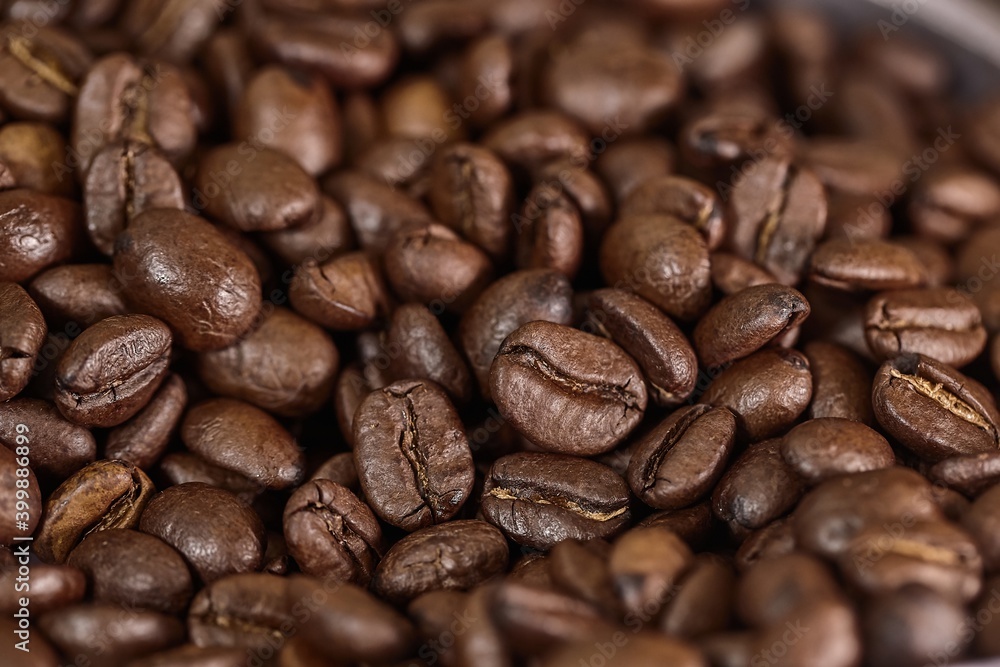 Coffee beans pile background closeup Coffee beans pile background closeup