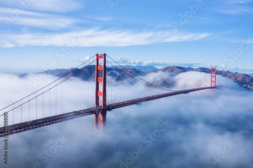 Fototapeta Naklejka Na Ścianę i Meble -  Aerial view on Golden gate bridge on a foggy day 