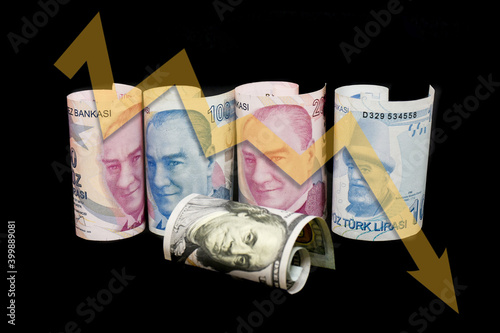 Fototapeta Naklejka Na Ścianę i Meble -  Turkish lira and American dollar bills. Turkish lira plunges, crashing. Turkey's lira crisis. Turkish lira is going down.