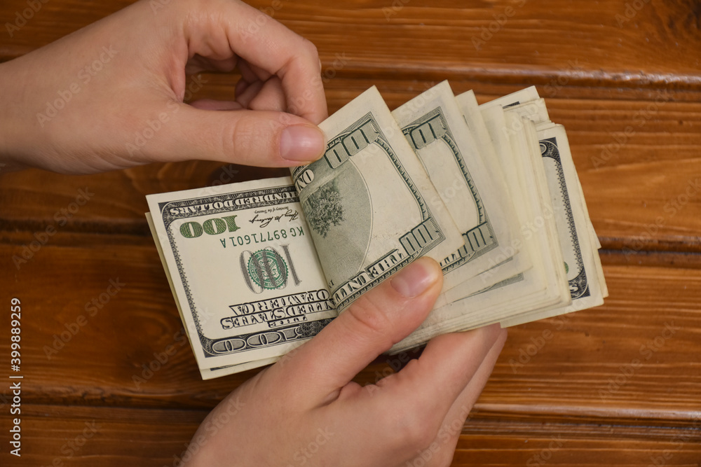 Hands counting dollar bills isolated on white background. Counting or spend money. Hands counting dollar bills isolated on white background. Counting or spend money.