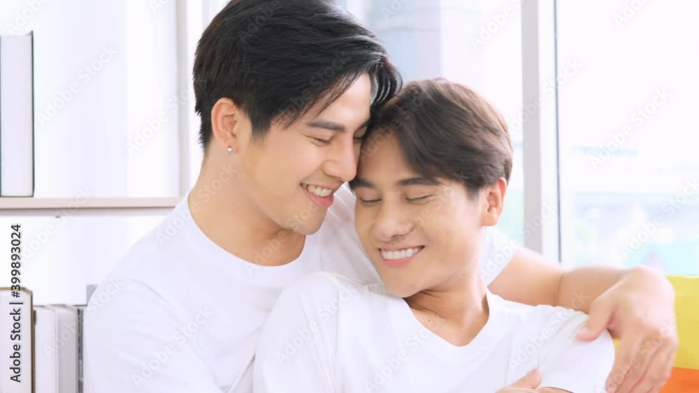 Gay asian couple happy together kissing and hugging. Gay asian couple happy together kissing and hugging.