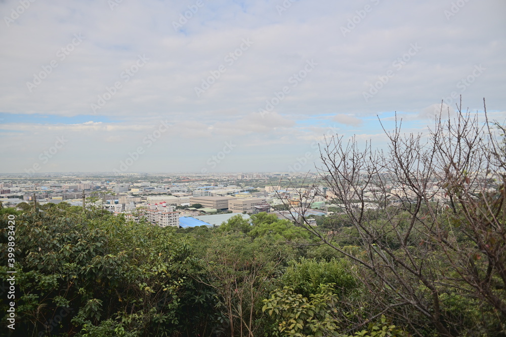 The panoramic view of the city from the mountaintop on one sunny day.