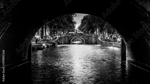 Photography Black and White photo of View of seven historic bridges in a straight line over