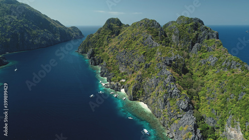 Relax seascape with water transport of El Nido Islets, Palawan, Philippines, Asia. Philippines Hill Highland Islands at ocean gulf aerial view. Cinematic summer tourism in soft light shot