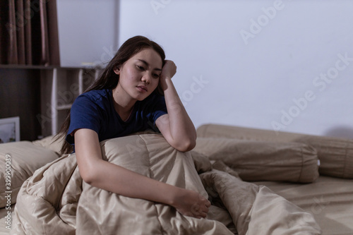 Young asian woman cannot sleep insomnia late at night. Can't sleep. Sleep apnea or stress. Sleep disorder concept. © Oulaphone