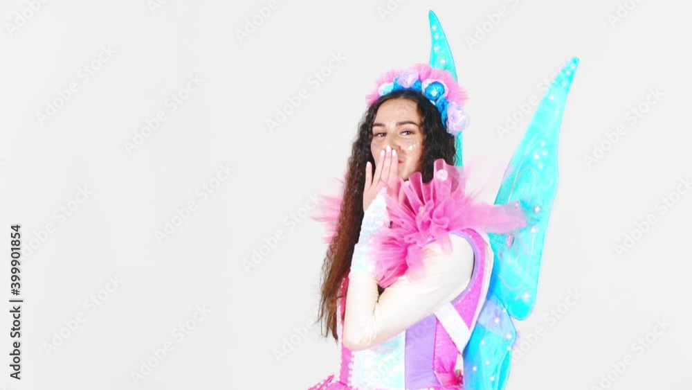 Portrait of a young cute girl in a beautiful costume of a magic fairy isolated on a white background. Animators in costumes. Entertainment for children Portrait of a young cute girl in a beautiful costume of a magic fairy isolated on a white background. Animators in costumes. Entertainment for children