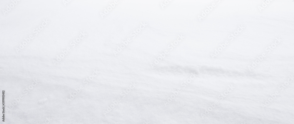 White soft and fuzzy snow with outdoor natural light in December winter season. Close up pure and clean on little smooth wave at snow surface. Panorama background with copy space.