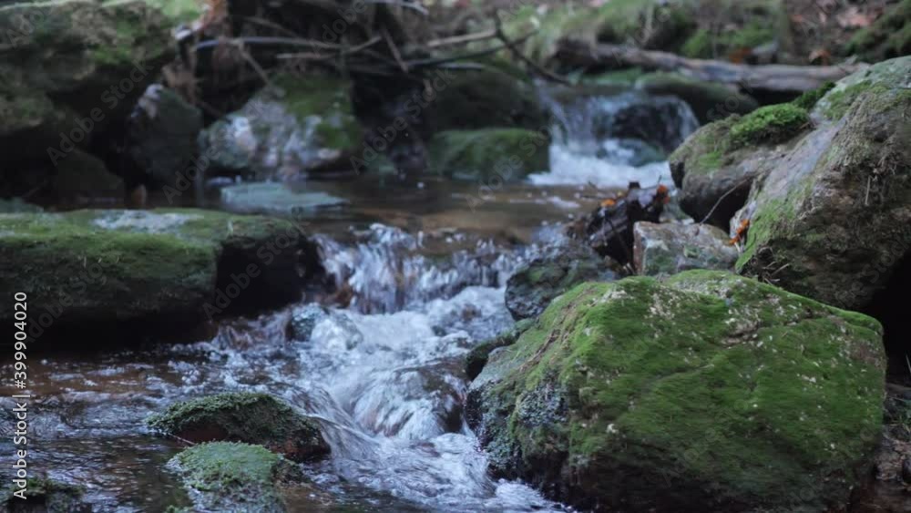 Mountain Creek Flowing Between Rocks, Close Up Slow Motion. Freshwater in Woods. Mountain Creek Flowing Between Rocks, Close Up Slow Motion. Freshwater in Woods.